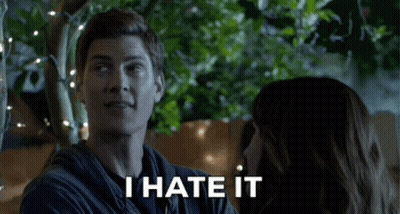 Man And Woman Looking At Each Other Saying I Hate It GIF