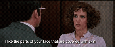 Man And Woman Looking At Each Other Saying I Like The Parts Of Your Face That Are Covered With Skin GIF