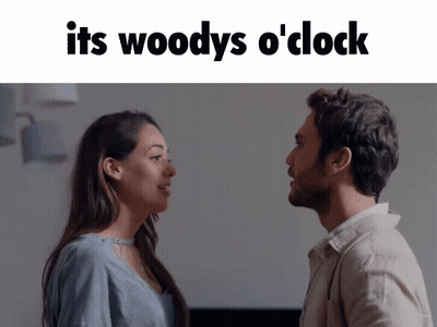 Man and Woman Looking at Each Other Saying It's Woody's O Clock