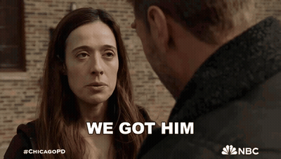 Man And Woman Looking At Each Other Saying We Got Him GIF