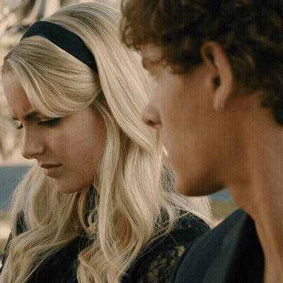 Man And Woman Looking At Each Other With Black Headband GIF