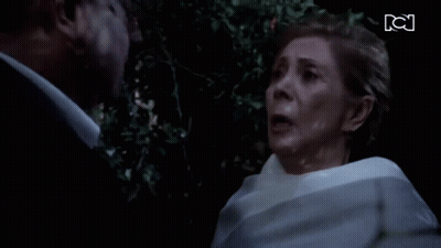 Man And Woman Looking At Each Other With KC GIF