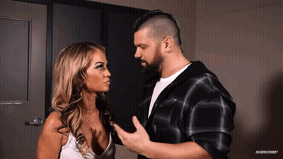 Man And Woman Looking At Each Other With Subscribe GIF