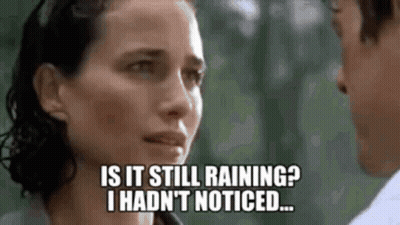 Man And Woman Looking At Each Other Woman Asking If Still Raining GIF