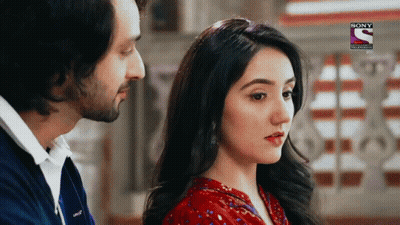 Man And Woman Looking At Each Other Woman In Red Top GIF