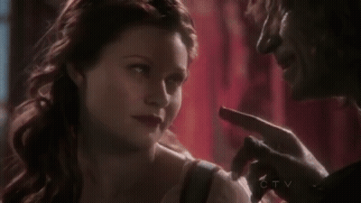 Man And Woman Looking At Each Other Woman Pointing At Face GIF