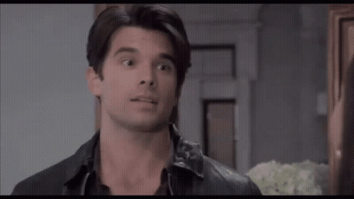 Man And Woman Looking At Each Other Woman With Hoop Earrings GIF