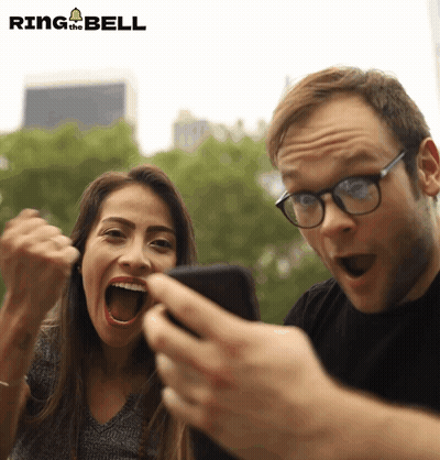 Man And Woman Looking At Phone Ring The Bell GIF