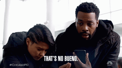 Man And Woman Looking At Phone Saying No Bueno GIF
