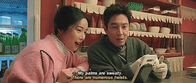 Man And Woman Looking At Tablet GIF