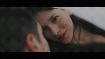 Man And Woman Looking Into Each Other's Eyes GIF