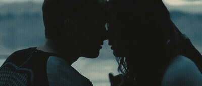 Man And Woman Looking Into Each Other's Eyes In The Dark GIF