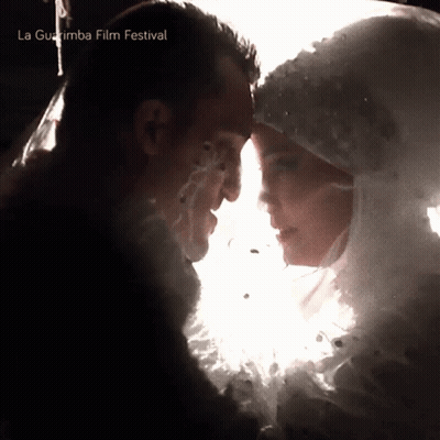Man And Woman Looking Into Each Other's Eyes La Guajira Film Festival GIF