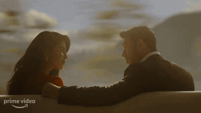 Man And Woman Looking Into Each Other's Eyes With Prime Video Logo GIF