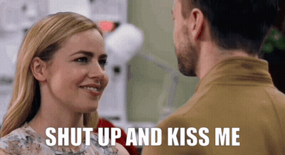 Man And Woman Looking With Shut Up And Kiss Me GIF