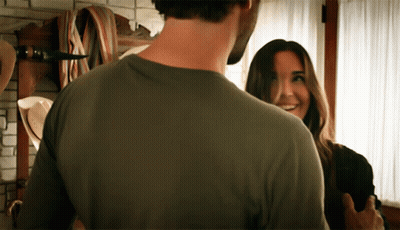 Man And Woman Looking, Woman Smiling GIF