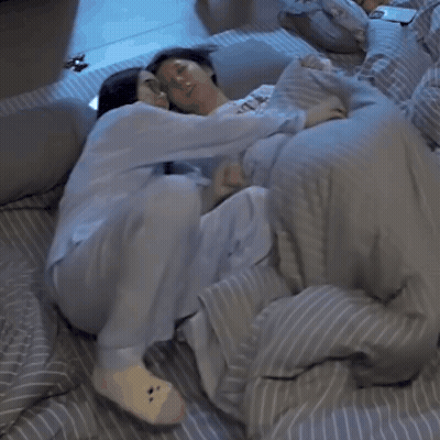 Man And Woman Lying In Bed GIF