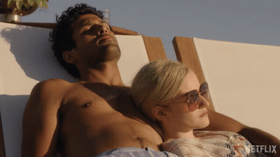 Man And Woman Lying On Beach Chair GIF