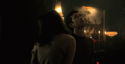 Man And Woman Making Eye Contact Red Curtain GIF