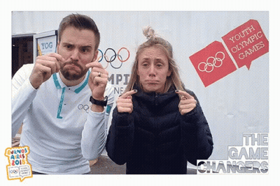 Man And Woman Making Funny Faces At Youth Olympic Games Sign GIF