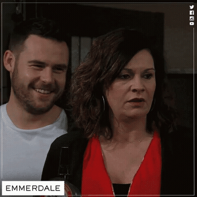 Man And Woman Next To Emmerdale GIF