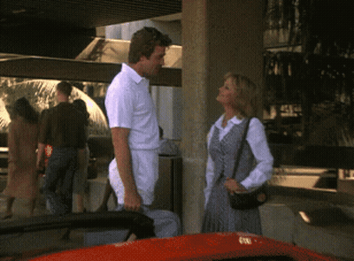 Man And Woman Next To Red Car GIF