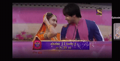 Man And Woman Next To Sony Entertainment GIF