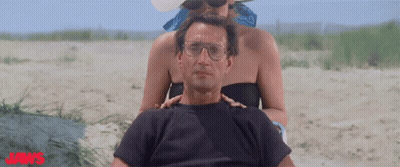 Man And Woman On Beach With Jaws GIF