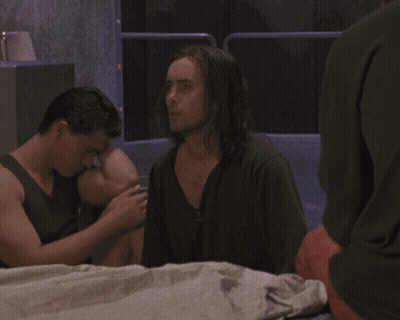 Man And Woman On Bed Hands On Heads GIF