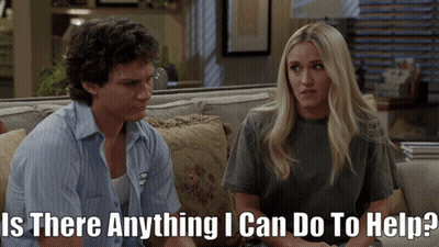 Man and Woman on Couch Saying Is There Anything I Can Do to Help