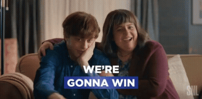 Man And Woman On Couch We're Gonna Win GIF