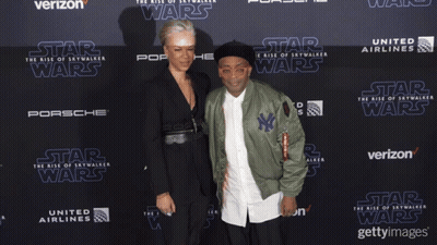 Man And Woman On Red Carpet For Star Wars GIF