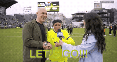 Man And Woman On Soccer Field Saying Let's Go GIF