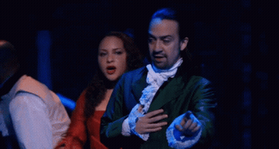Man And Woman On Stage Man In Green Jacket And Tie GIF
