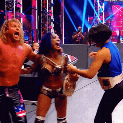 Man And Woman On Stage With Belt Saying The Next Thing GIF