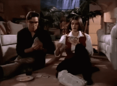 Man And Woman Playing Cards GIF