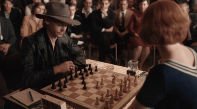 Man And Woman Playing Chess GIF