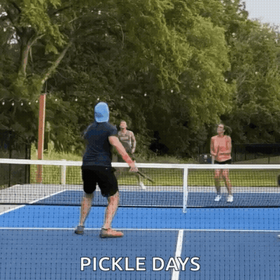 Man And Woman Playing Pickleball GIF