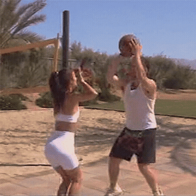 Man And Woman Playing Volleyball On Sunny Day GIF