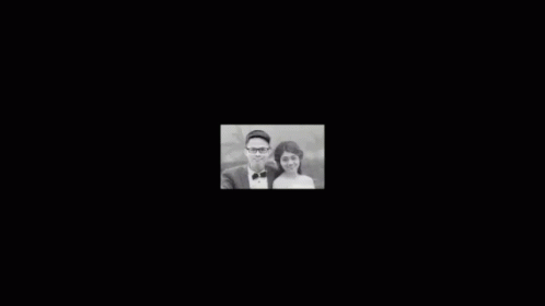 Man And Woman Posing For Photo GIF
