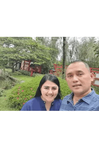 Man And Woman Posing For Picture In Garden Sticker