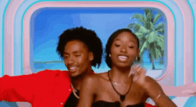 Man And Woman Posing In Front Of Window GIF