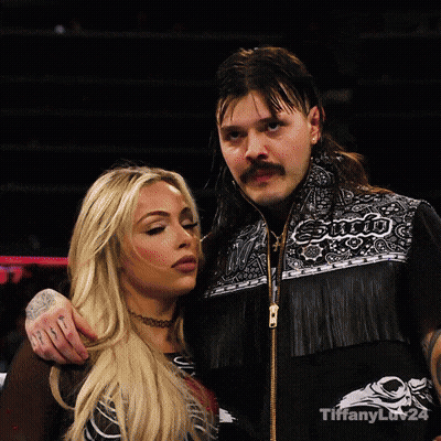 Man And Woman Posing With Enjoi Jacket GIF