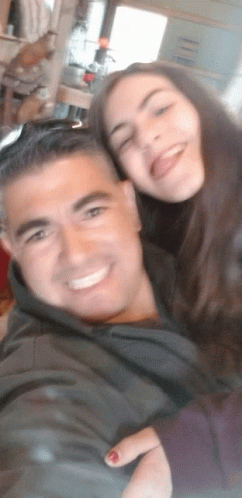 Man And Woman Posing With Tongue Out GIF