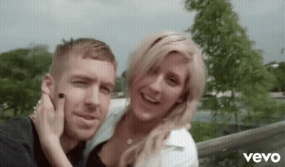 Man And Woman Posing With Vevo GIF