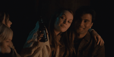 Man And Woman Posing, Woman Holds Jack Daniels GIF