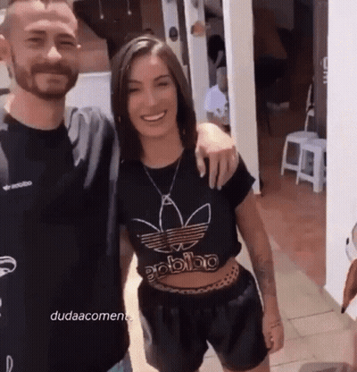 Man And Woman Posing, Woman In Black Adidas Shirt GIF