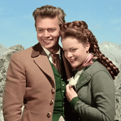 Man And Woman Posing Woman In Green Jacket GIF