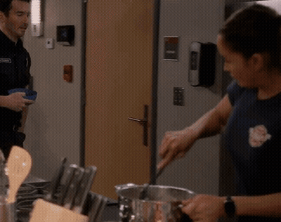 Man And Woman Preparing Food In Kitchen GIF