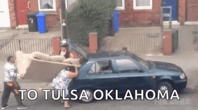 Man And Woman Pushing Couch Into Car To Tulsa Oklahoma GIF